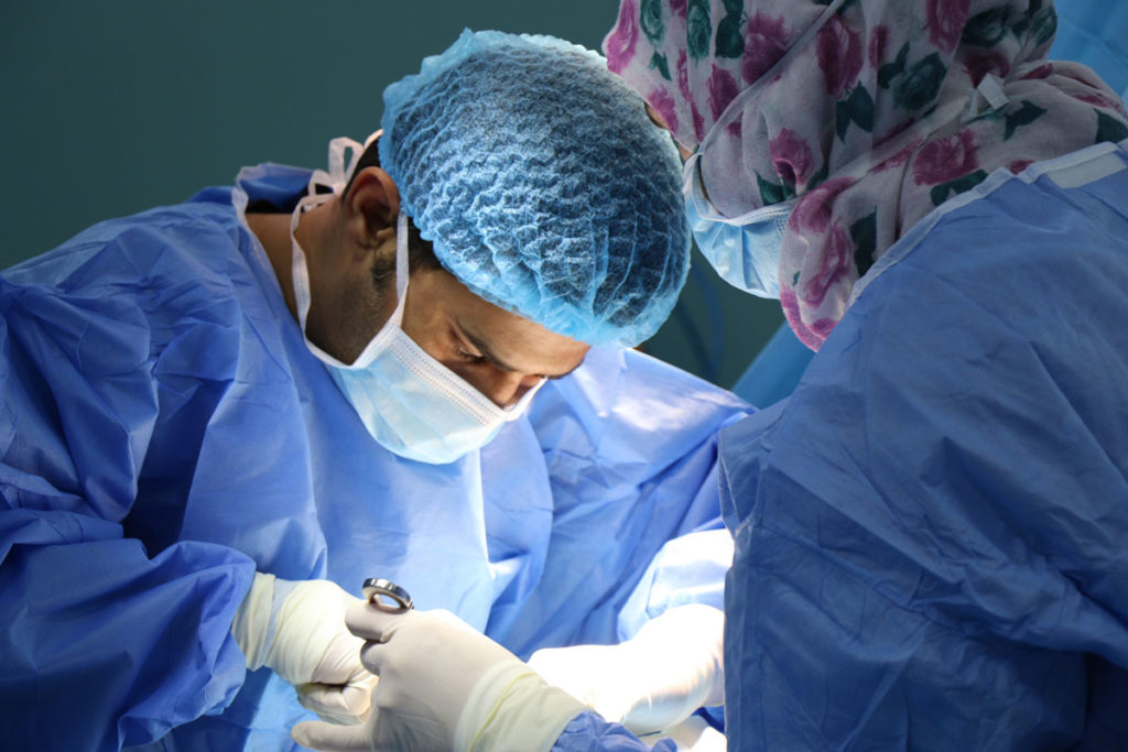 Photo of doctors performing surgery